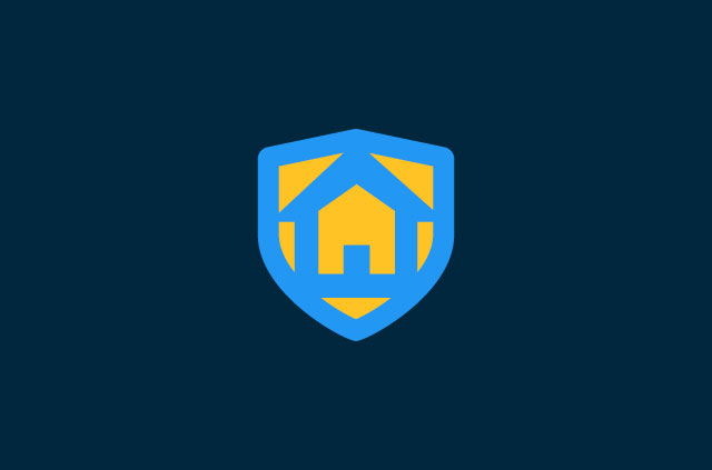 Shield with a home on it.